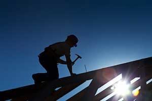 Roofing contractor working on roof during Northern Virginia roofing services