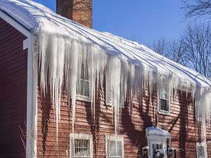 Ice built up on roof that causes major roof repair