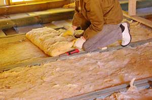 Attic Insulation being installed by Leesburg ,VA insulation contractor