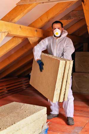 Attic insulation work being performed by Alexandria, VA insulation contractors