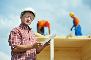 a contractor and his coworkers conducting an Ashburn, VA roof repair