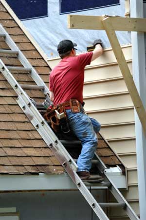 Rosslyn, VA siding contractors installing new siding on home
