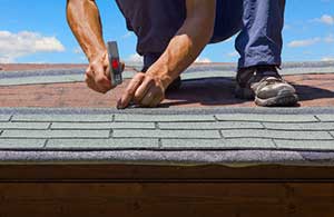 Shingles being installed by Aldie, VA roof repair contractors