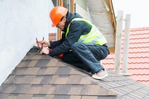 Northern VA roof repair contractor performing a routine checkup on a roof