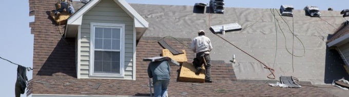 Emergency roof tarping services before a massive storm strikes a Fairfax, VA house