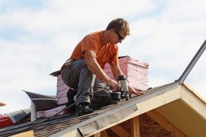 roof repair contractor in Fairfax, VA working on fixing a roof