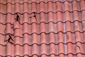 A clay roof in obvious need of a roof repair contractor from Beyond Exteriors
