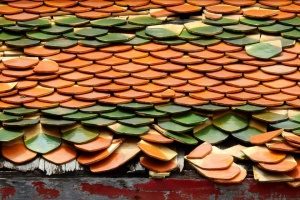 A tile roof that is damaged and in need of roof repair
