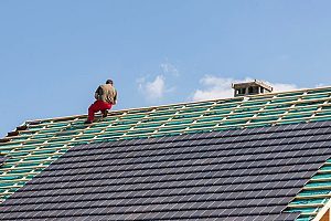 roof maintenance work being done by a contractor in order for the roof to be 100 percent functioning again