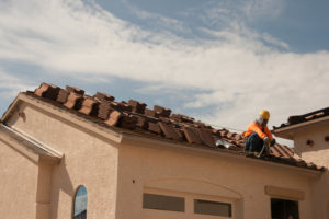 Roof repair service with shingles prepared