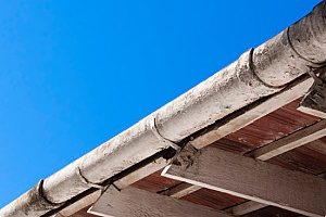 the roof fascia of a house in Fairfax, VA that is covered in mold and therefore gutter installation contractors must replace the gutters