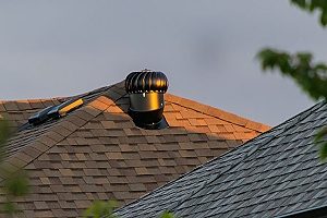 a bronze roof vent that had to be installed with an accompanying roof repair since the old vent broke and the roof was previously damaged due to frequent storms
