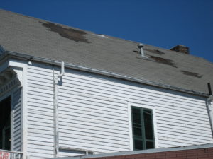 Wind damage to roof shingles