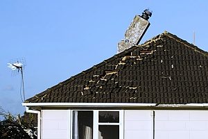 a massive amount of roof damage to a Fairafx, VA home after a storm so the homeowners will contact Fairfax roof repair contractors
