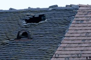 a giant opening in a roof that will need a Fairfax, VA roof replacement since a roof repair would not fix the hole and warping