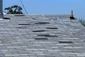 a healthy roof in Fairfax, VA that has a few replacement shingles to hold the roof intact until the homeowners decide on a full roof replacement