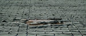 damaged roof in need of repair in Fairfax, Virginia