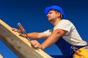 mclean-roofing-contractor-holding-roof-instrument