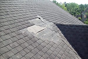 a damaged roof owned by a homeowner who wants to know how often should you replace your roof