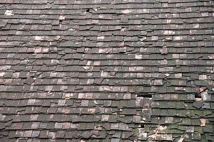 broken down shingles that should receive a roof replacement instead of reroofing