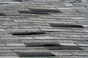 roof shingles that were blown off by a storm and need to be replaced