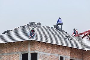 a roofing company performing a Fairfax, VA roof replacement after the homeowner asked insurance roof replacement questions