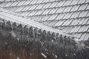 a roof during a rain storm that has complete roof protection