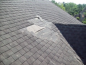 missing shingles from a damaged roof