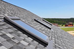 a roof with skylights that will be measured by a homeowner