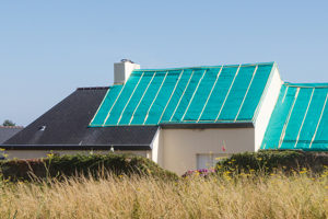 house in the country with roof tarping